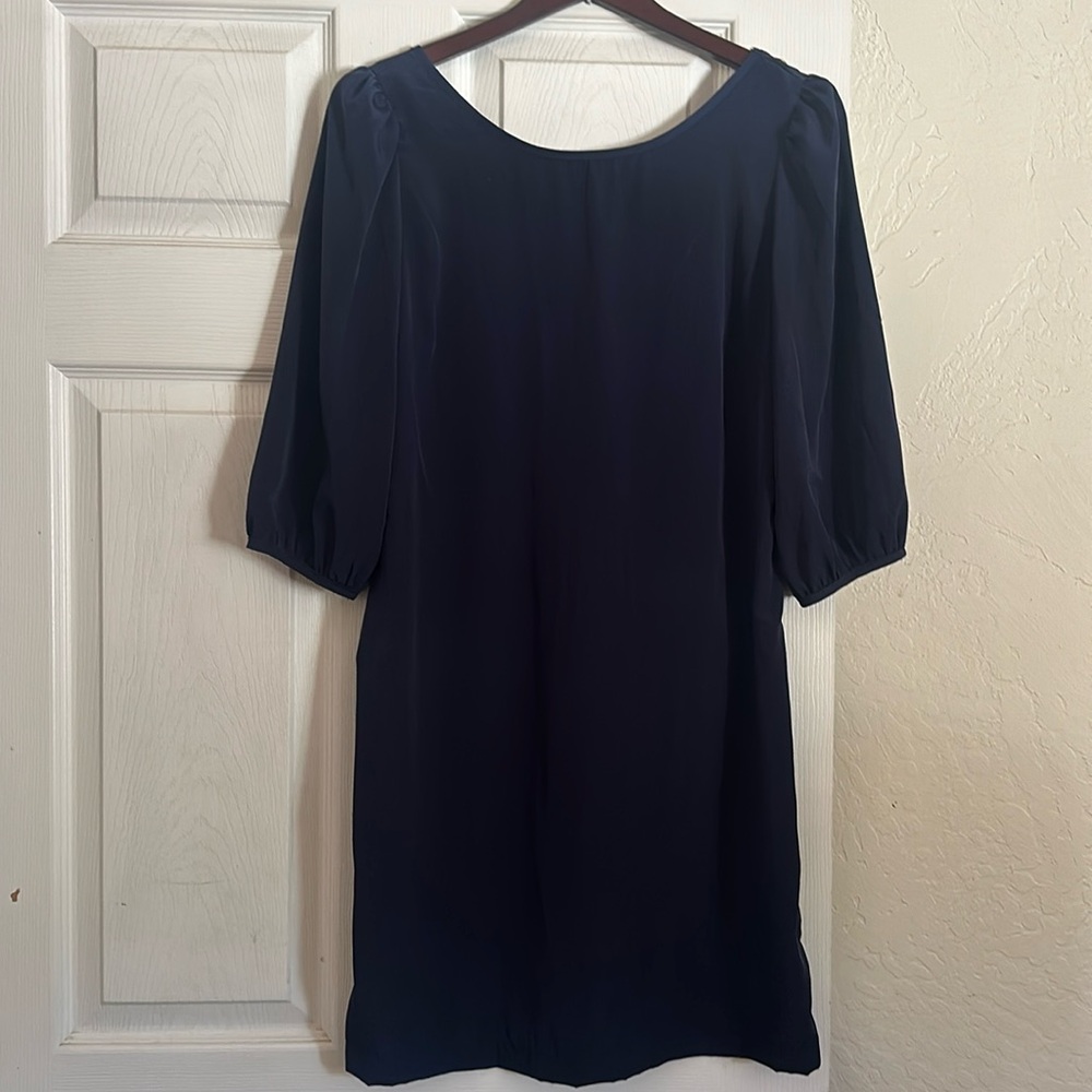 Deep blue, high neck dress.